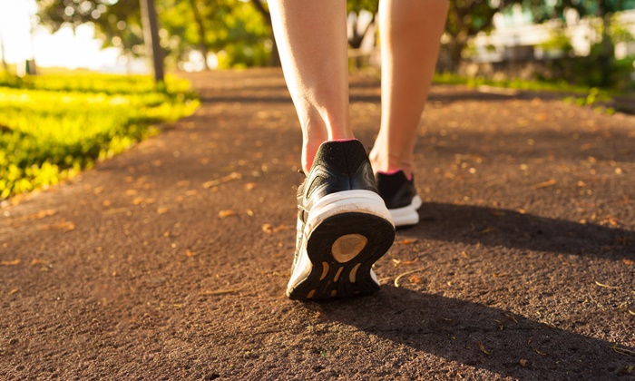 Woman Walking On A Path